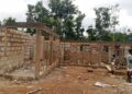 Construction workers build the first elementary school in Behla Town, Bong County, ending more than six decades without a local educational facility.