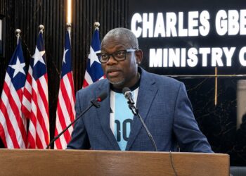 Information Minister Jerolinmek Piah speaks during a government press briefing while defending the Boakai administration's performance against criticism from opposition figure Eugene Nagbe.