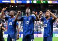 Players from African national teams celebrate after qualifying for the Round of 32 at the 2026 FIFA World Cup.