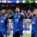 Players from African national teams celebrate after qualifying for the Round of 32 at the 2026 FIFA World Cup.