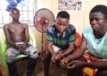 Three robbery suspects seated in custody after being charged by police in connection with a knife-point robbery case in Gbarnga, Bong County.