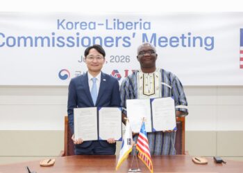 LRA Commissioner General James Dorbor Jallah and South Korea National Tax Service Commissioner General Lim Kwang-hyun display signed cooperation agreements during a meeting in Seoul.