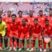 Liberia national football team players pose for a team photograph before an international match.