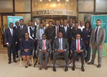Central Bank of Liberia Governor Henry Saamoi and banking stakeholders participate in a seminar on cross-border payment systems and correspondent banking in Monrovia.