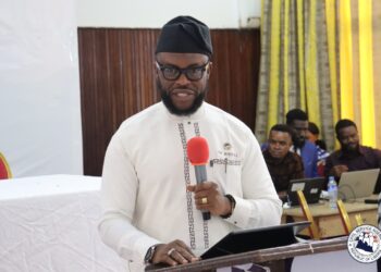 Civil Service Agency Director-General Dr. Josiah Joekai Jr. speaks at a constitutional reform dialogue in Monrovia, advocating major changes to Liberia's Constitution.
