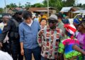 Agriculture Minister J. Alexander Nuetah and Mainland Group officials meet farmers in Grand Bassa County to discuss a US$36 million rubber farming initiative.