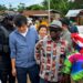 Agriculture Minister J. Alexander Nuetah and Mainland Group officials meet farmers in Grand Bassa County to discuss a US$36 million rubber farming initiative.