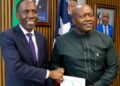 Liberian and African Development Bank officials sign a US$16.7 million economic reform agreement in Monrovia.