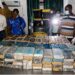 Liberian drug enforcement officers display hundreds of cocaine packages seized at Roberts International Airport during a major anti-narcotics operation.