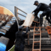Liberian security officers remove suspected cocaine from a warehouse during a raid in Duazon, Margibi County.