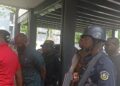 Paul King at the Monrovia City Court being escorted by armed police