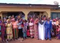 Graduates of the Bong County single mothers skills training program receive certificates in Gbarnga.