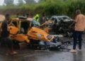 Traffic officers respond to a serious road crash on a Liberian highway as emergency responders assist victims.