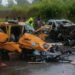 Traffic officers respond to a serious road crash on a Liberian highway as emergency responders assist victims.