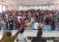 Faculty and staff gather during the University of Liberia General Assembly that voted to shut down campuses and pass a vote of no confidence.