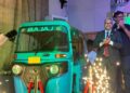 India's Ambassador Manoj Bihari Verma attends the launch of the Bajaj RE 236-4V three-wheeler in Liberia.