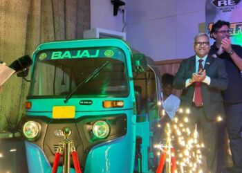 India's Ambassador Manoj Bihari Verma attends the launch of the Bajaj RE 236-4V three-wheeler in Liberia.
