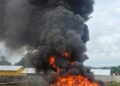 Liberian security officials oversee the destruction of seized cocaine at the LMHRA waste disposal site in Margibi County.