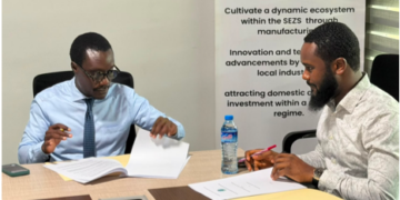 Officials sign the construction contract for the Liberia Packaging Solutions Center.