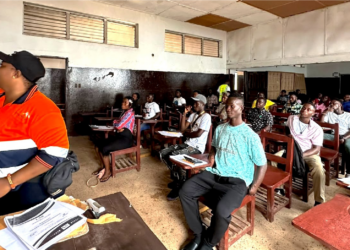 Residents of Grand Bassa County participate in ArcelorMittal Liberia's Learning Ability Battery assessment for employment opportunities.
