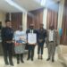 Sen. Prince K. Moye receives an appreciation award from the National Association of Public Defenders of Liberia after securing a historic budget allocation.