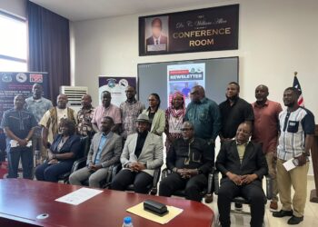 Civil Service Agency Director-General Josiah F. Joekai Jr. and Information Minister Jerolinmek Matthew Piah launch the CSA monthly e-newsletter in Monrovia.