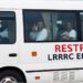 Officials receive foreign nationals transferred from the United States at Roberts International Airport in Liberia.