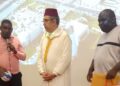 Officials of the Liberia National Handball Association honor Morocco's Ambassador Lahoucine Rahmouni during the Kingdom of Morocco's Throne Day celebration.