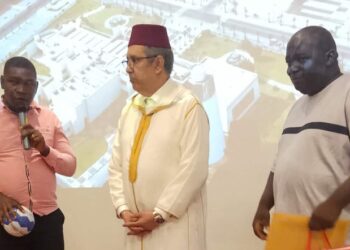 Officials of the Liberia National Handball Association honor Morocco's Ambassador Lahoucine Rahmouni during the Kingdom of Morocco's Throne Day celebration.