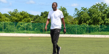 Tapha Manneh walking on the field