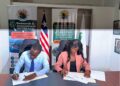 Officials from LSEZA and the Liberia National Tourism Authority sign an agreement to establish Liberia's first Special Tourism Economic Zone at Lake Piso.