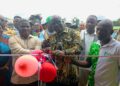 Officials and border personnel attend the opening of the temporary ECOWAS joint border post at Bo Waterside, Liberia