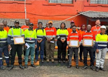 Four ArcelorMittal Liberia rail workers honored at a safety ceremony in Buchanan