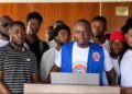 Leaders of the Alternative National Youth Congress present the July State of the Youth Report in Monrovia.