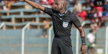 Zambian referee Hillary Hambaba officiates an international football match