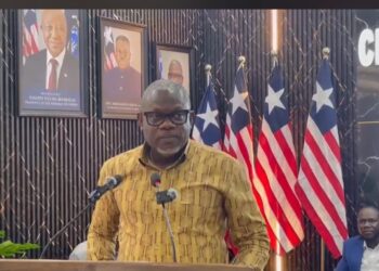 Information Minister Jerolinmek Piah speaking at a government press briefing