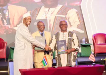 LRA Commissioner General James Dorbor Jallah and GRA Commissioner General Yankuba Darboe sign a technical cooperation agreement in Accra