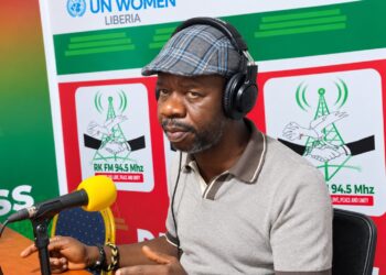 Garrison Doldeh Yeanue speaks to reporters about political tolerance and employment in Nimba County