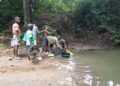 Gbarney residents near a community water source in Bong County