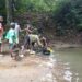 Gbarney residents near a community water source in Bong County