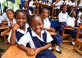 Primary school children wearing their school uniforms.