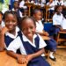 Primary school children wearing their school uniforms.