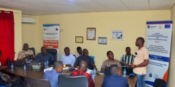 Participants at a workshop reviewing Liberia’s investigative journalism training manual.