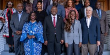Wala Blegay and Ambassador Al-Hassan Conteh with trade delegation members and Liberian Embassy staff.