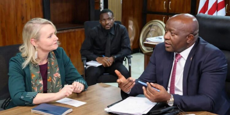 Finance Minister Augustine Kpehe Ngafuan and U.S. Chargé d’Affaires Kristin Gilmore.