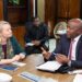 Finance Minister Augustine Kpehe Ngafuan and U.S. Chargé d’Affaires Kristin Gilmore.