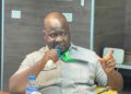 Acting Commerce Minister Stephen M. Yekeson Jr. announcing market pricing measures in Monrovia.