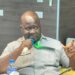 Acting Commerce Minister Stephen M. Yekeson Jr. announcing market pricing measures in Monrovia.