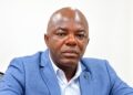 Labour Ministry Deputy Inspector General Darius K. Weamie speaking at a news conference in Monrovia.