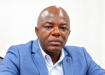 Labour Ministry Deputy Inspector General Darius K. Weamie speaking at a news conference in Monrovia.